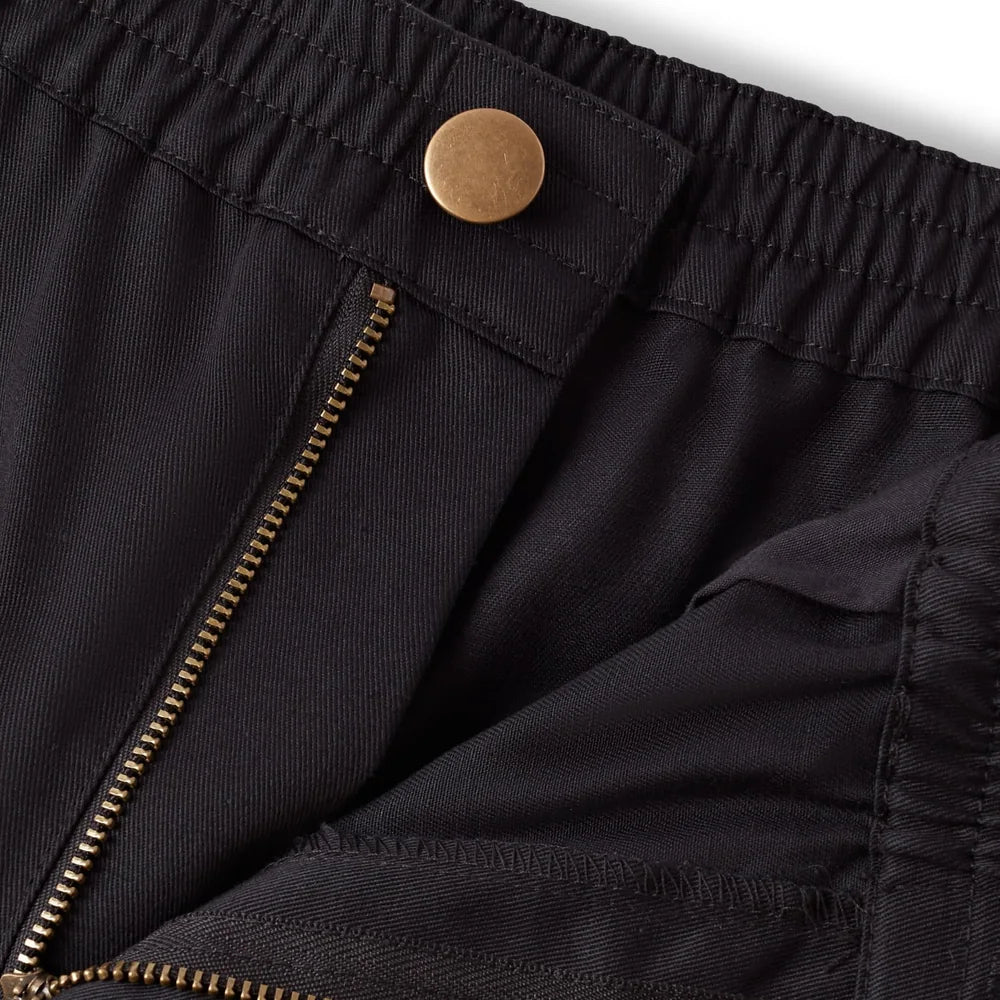 Brass button and zip on the chef trousers